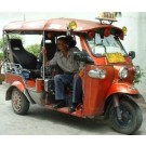 The Tuk Tuk. (My thanks go to Ron Seike for sending in this photo. Ron notes that the photo is a Tuk tuk from Chiang Mai. Unlike Bangkok owners, the owners in Chiang Mai are inclined to customize their vehicles extensively, probably in an effort to attrac